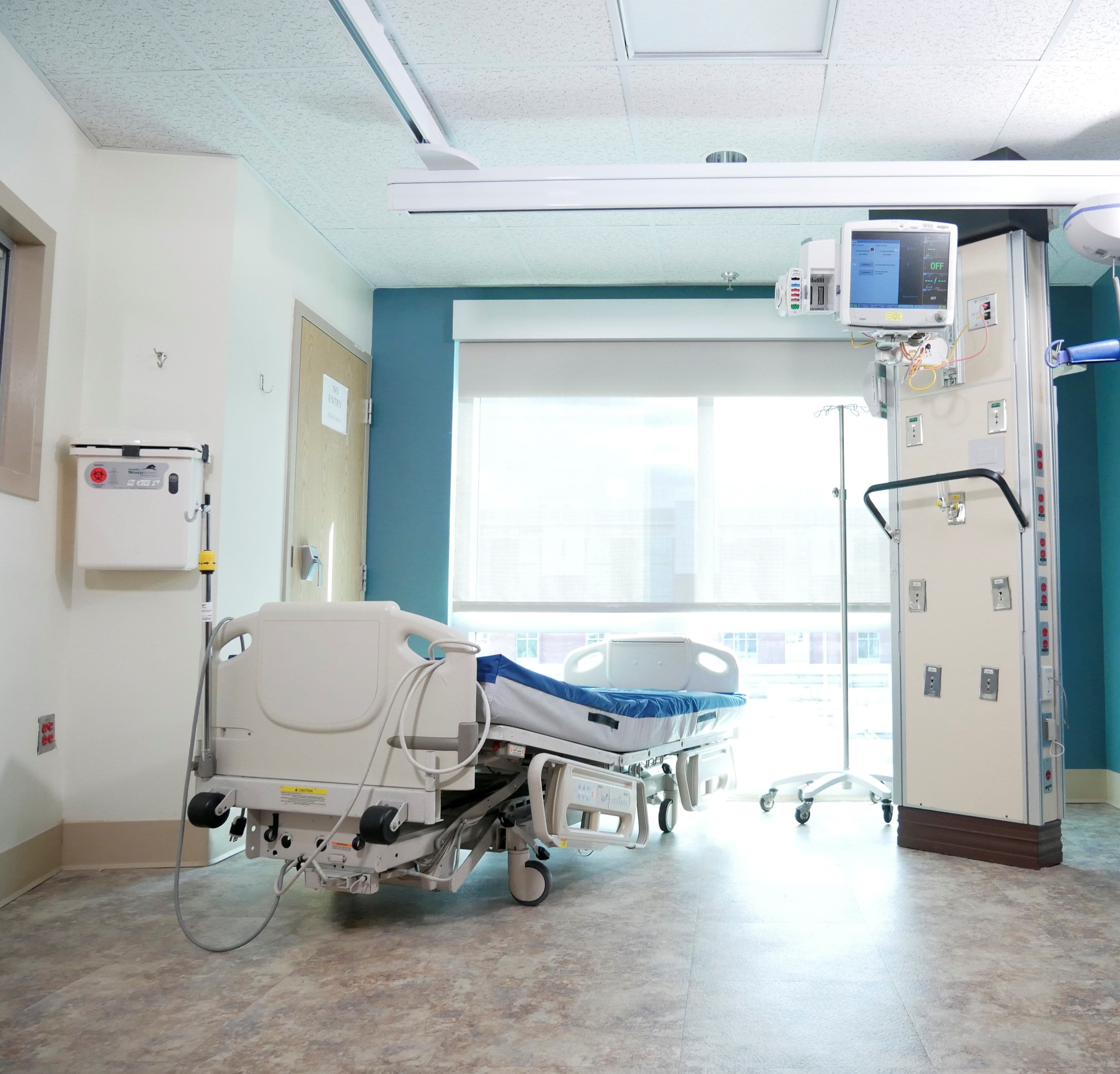 Hospital bed and care equipment in a clinical room